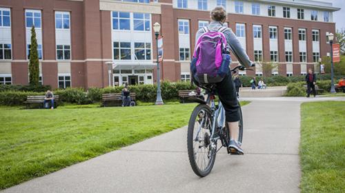 Woman on bike on Oregon State campus