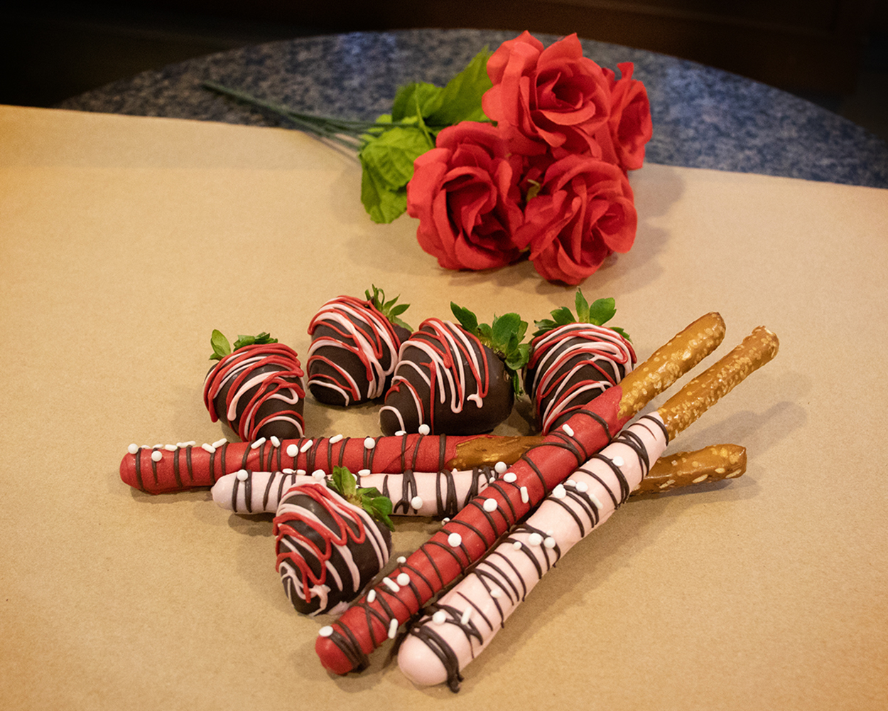 chocolate covered strawberries and pretzel sticks